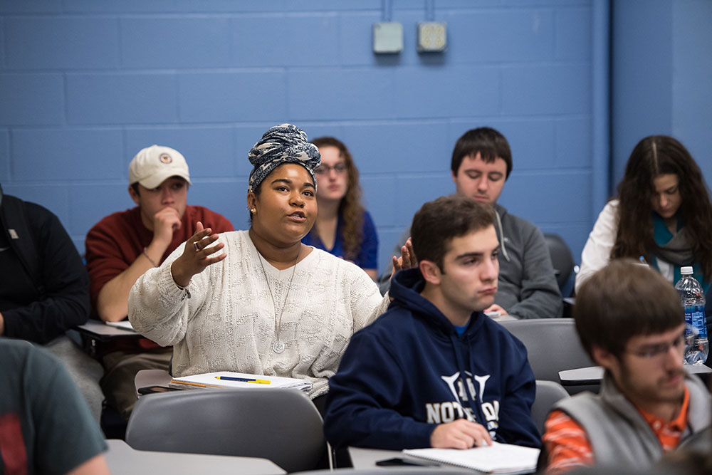 Enuma Okafor ’18 participates in class discussion. Professor Lynda Powell encourage students to read widely and apply their own insights to the 2016 elections. (University photo / J. Adam Fenster)