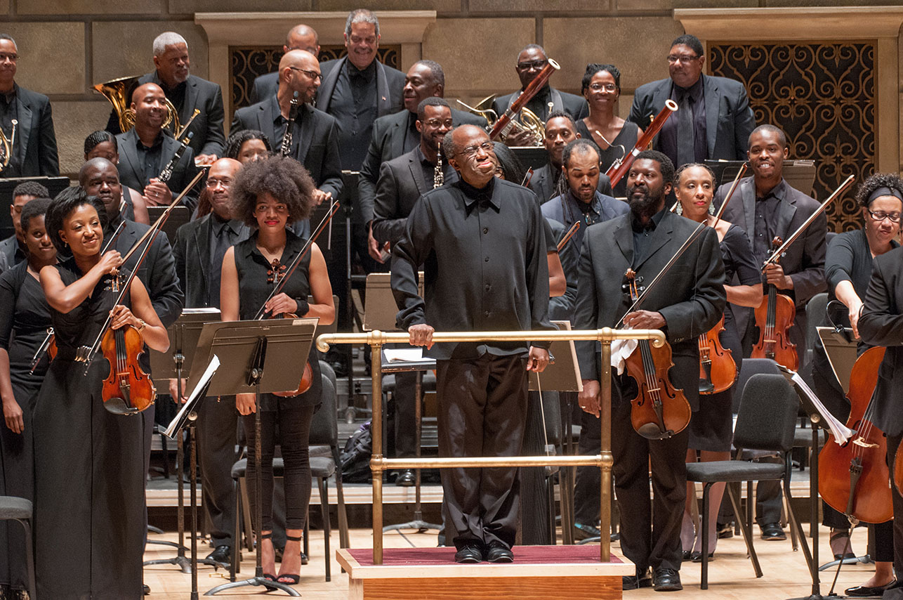 Concert master Kelly Hall-Tompkins ’93E (above, left), conductor Michael Morgan, and members of the Gateways Festival Orchestra rise to applause after the final performance of the 2015 festival in Kodak Hall at Eastman Theatre. (University photo / Keith Bullis)